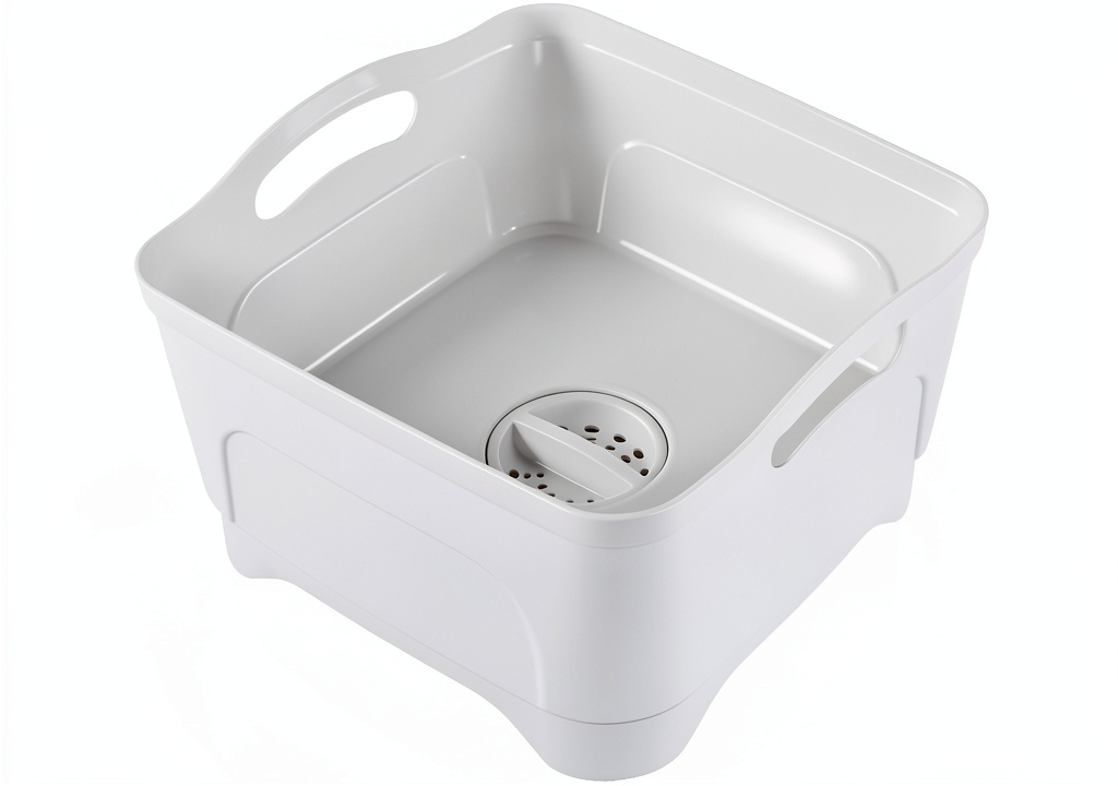 Lesbin RV sink placed on a campsite table with dishes and a portable stove